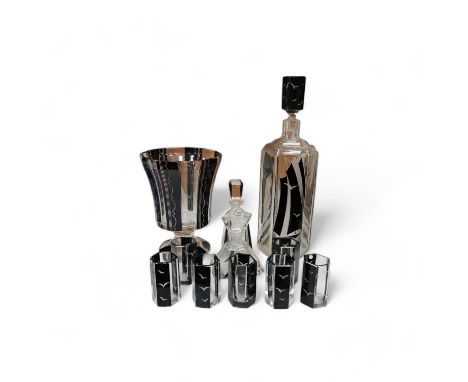 In the manner of Karl Palda (Czechoslovakian), an Art Deco flashed glass liqueur set comprising of a decanter and seven glass