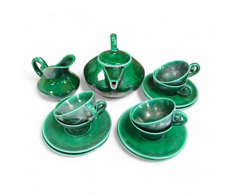 A Vallauris French bright green tea service,  with six cups saucers  milk jug and tea pot, jug 12.5cm high. Condition - fair 