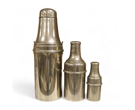 A 1920's chrome plated travelling cocktail flask set and two similar cased bottles, tallest 28.5cm high. Condition - fair