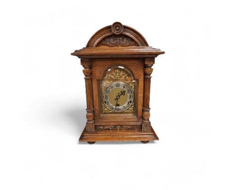 An oak bracket clock with a German three train movement, chiming on five gongs, 47cm high. Condition - fair to good, some wea