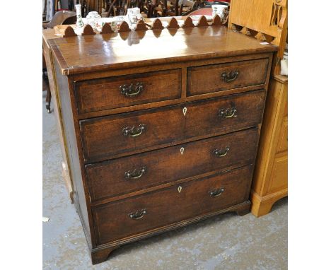 19th century oak and mixed woods inlaid straight front chest of two short and three long drawers with ivory escutcheons on a 