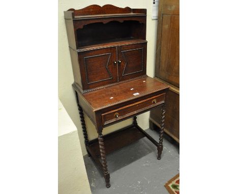 Early 20th Century small oak writing desk with raised cupboard back and frieze drawer on barley twist legs. (B.P. 21% + VAT)B