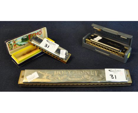 Three M Hohner mouth organs to include; Echo Super Vamper, in original box, a Polyphonia and a Cross Harp MS in plastic case.