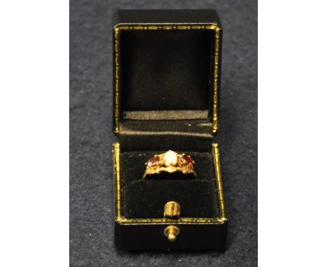 9ct gold garnet and opal ring. Size M & 1/2. Approx weight 1.8g.(B.P. 21% + VAT) 