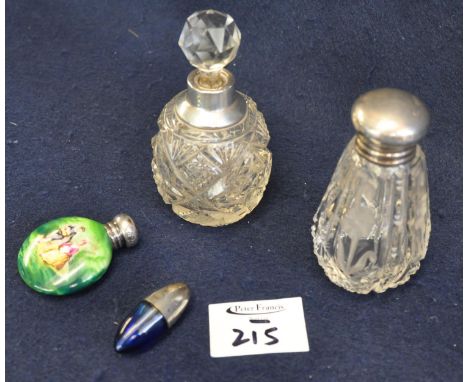 Two cut glass scent bottles with silver tops or collars, a small blue glass egg shaped scent bottle with white metal top and 
