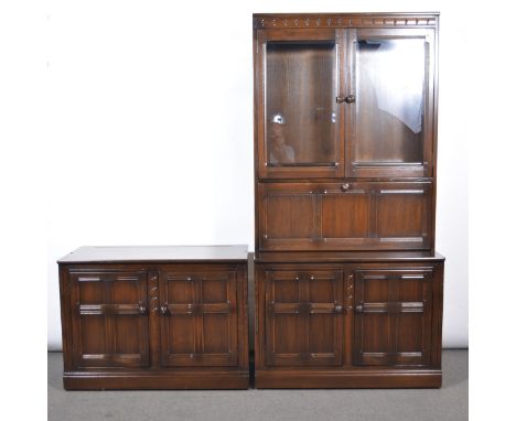 Suite of Ercol dark elm side cabinets, one with glazed doors over a shelf, drawer and cupboard base, width 98cm, depth 541cm,