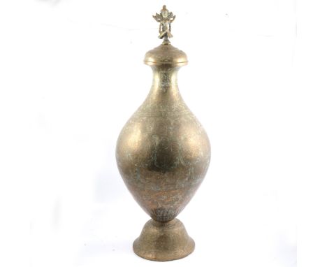 Indian engraved brass urn, cast figural finial, 76cm.