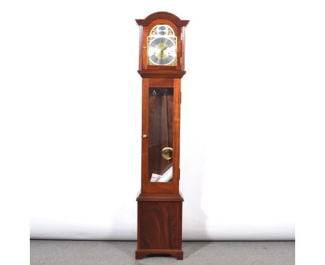 Modern Fenclocks grandmother clock, mahogany case with domed hoop, long glazed door, bracket feet, 8" arched brass dial, twin