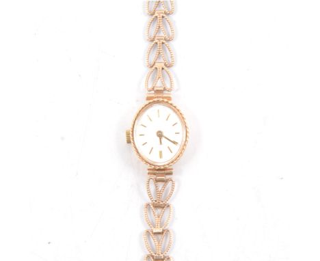 Rotary - a lady's 9 carat yellow gold quartz bracelet watch, oval silvered baton dial in a polished oval case and fitted with