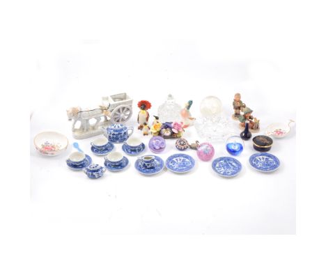 A child's miniature teaset, Willow pattern; a Beswick penguin carrying a parasol, and two penguin chicks; Caithness and other