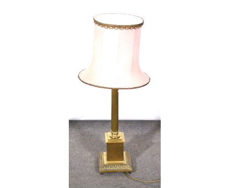 A brass and copper mounted table lamp, 83cm with shade.