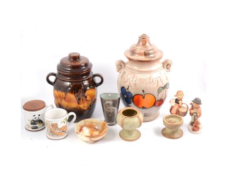 Hummel figures of a boy violinist and a girl; a West German Scheurich 'Rümtopf' pot with lid, 36cm; another with treacle glaz