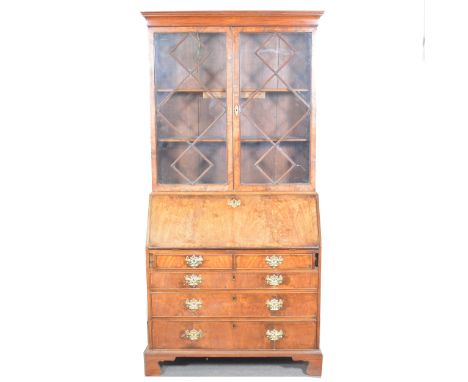 George III mahogany bureau bookcase, cavetto moulded cornice, glazed doors to the upper section with lozenge-shape bars, fall