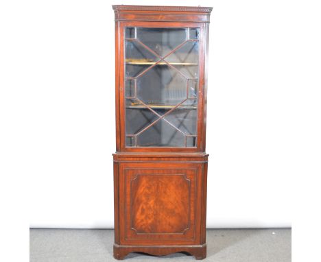 Mahogany freestanding corner cupboard, dentil and cavetto cornice, astragal glazed door enclosing two shelves, cupboard under