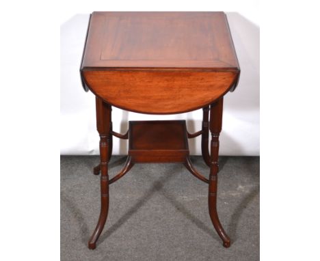 Edwardian mahogany centre table, the top with four drop leaves, moulded edge, turned and ringed splayed legs joined by a shel