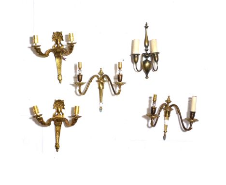 Modern brass three light chandelier and various wall lights, different designs.