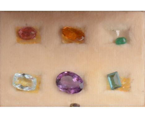 Six gemstones in presentation box from Rio De Janeiro 1981, emerald, aquamarine, tourmaline, topaz, amethyst.