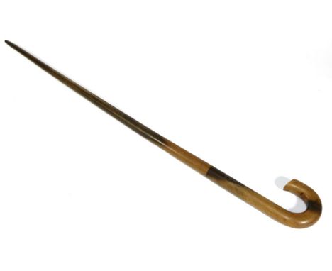 A Rhinoceros Horn Walking Stick, circa 1900, with scroll handle, 87cm longSome typical very minor surface splitting. Two chip