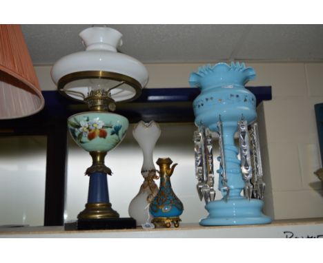 A LATE VICTORIAN BLUE GLASS LUSTRE, an oil lamp, a 19th Century glass jug with gilt metal overlay and white opaque vase (4)