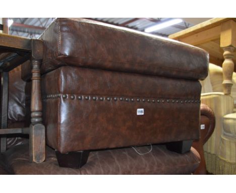A BROWN LEATHER RECLINING ARMCHAIR, another leather reclining armchair (broken mechanism) and a brown leather pouffe (3)