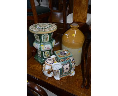 A GLAZED CERAMIC PLANT STAND, similar elephant and a flagon (3)