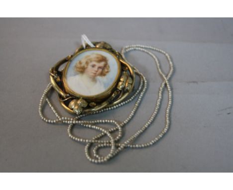 A VICTORIAN GOLD PORTRAIT MINIATURE BROOCH, together with a string of pearls (2) 