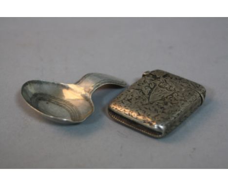 A VICTORIAN SILVER VESTA CASE, Birmingham 1894 and a Georgian silver caddy spoon, Birmingham 1816