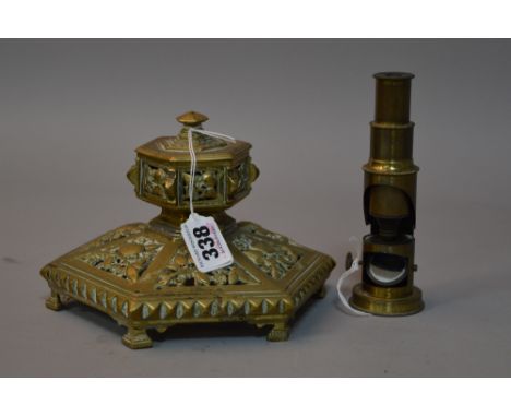A BRASS INKWELL AND A STUDENTS MICROSCOPE (2)