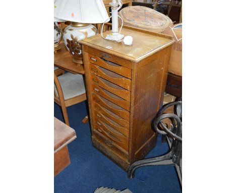 A LIGHT OAK FALL FRONT FILING CABINET, with nine fitted slides, approximate size height 108cm x width 48cm x depth 42cm (key)