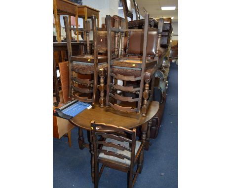 AN OAK GATE LEG TABLE AND FOUR LADDER BACK CHAIRS and three leather seated chairs (8)