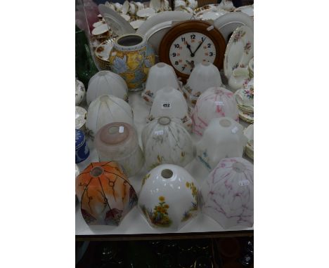 TWELVE GLASS LIGHT SHADES, a Bourne Denby moulded vase and a circular wall clock