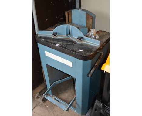 A MAGNOLIA PICTURE FRAME CUTTER with a cast iron bed and press steel base