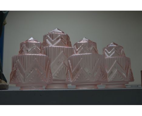A SET OF THREE PINK GLASS ART DECO MOULDED GLASS LIGHT SHADES, and a fourth larger matching