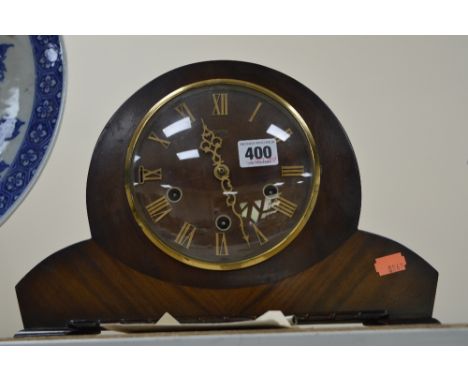 A WALNUT CASED MANTEL CLOCK, Westminster chime, with key and pendulum
