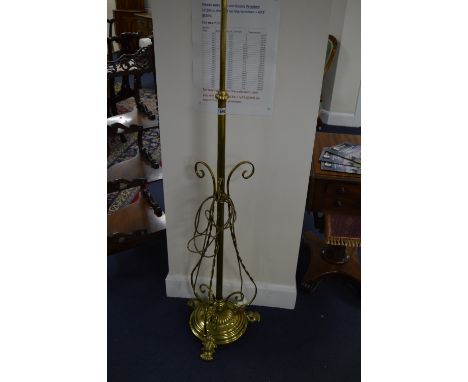 AN EARLY 20TH CENTURY BRASS TELESCOPIC STANDARD LAMP, with triple scrolled arms, approximate size height 155cm
