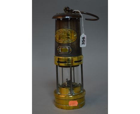 A BRASS MINERS LAMP, with plaque 'E.Thomas & Williams Ltd'