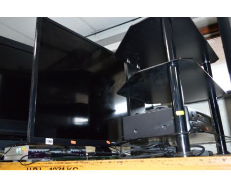 A POLAROID LE 40GCL-Y 40' LED TV, a glass TV stand, etc (remote) (3)