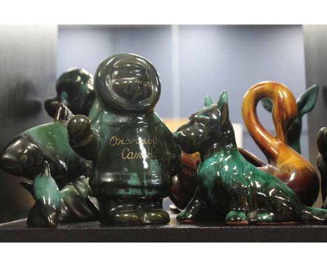 SELECTION OF BLUE MOUNTAIN CERAMIC FIGURES
including two dogs, a fish, a dolphin, two fawns, a swan and an eskimo, 19cm the h