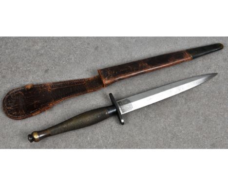 A WWII 2nd pattern Fairbairn Sykes commando fighting knife having a 6¼in. (15.8cm.) double edge spear point blade, 2in. (5cm.