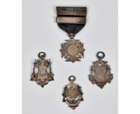 Royal Jersey Light Infantry interest - Four silver shooting medals awarded to J. JÉGU, the first of cross form, the centre in