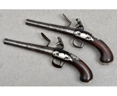 A pair of silver mounted 20 bore flintlock pistols by Joseph Clarkson, Circa 1730 with turn-off cannon barrels numbered '1' a