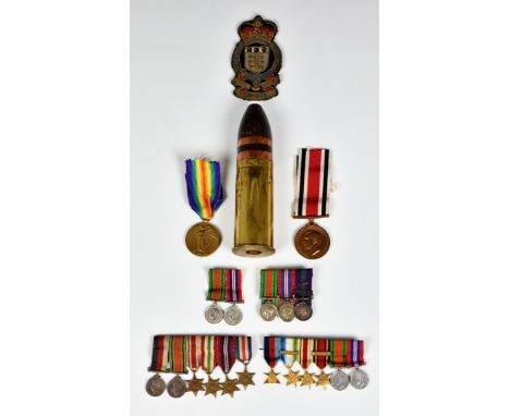 A small group of military collectables to include a Royal Army Ordnance Corps cloth badge; WWI Victory medal, issued to J.647