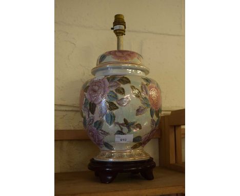 A floral decorated ceramic table lamp