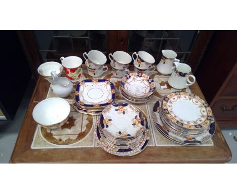 Two boxes full of ceramic and glass items, including a set of bone china.