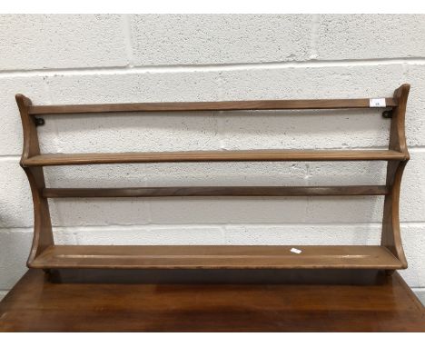 An Ercol hanging plate rack, height 50cm, width 95cm.