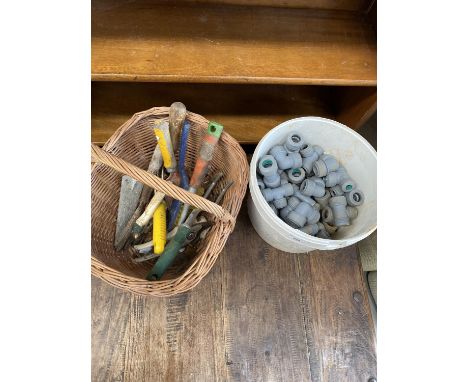 A basket of hand tools and push-fit pipe connectors.