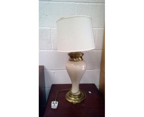 A ceramic table lamp, with brass mounts.