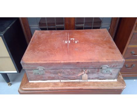 Vintage leather suitcase, contains knitted cardigans, shirts, etc.