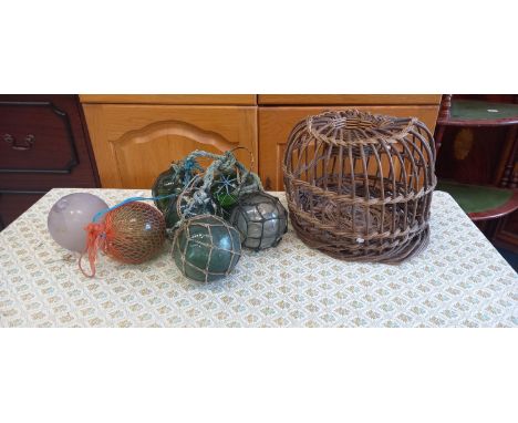 Seven vintage glass fishing floats, one damaged.
