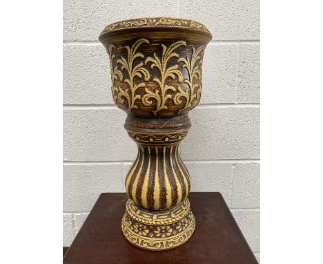 A ceramic jardiniere and stand